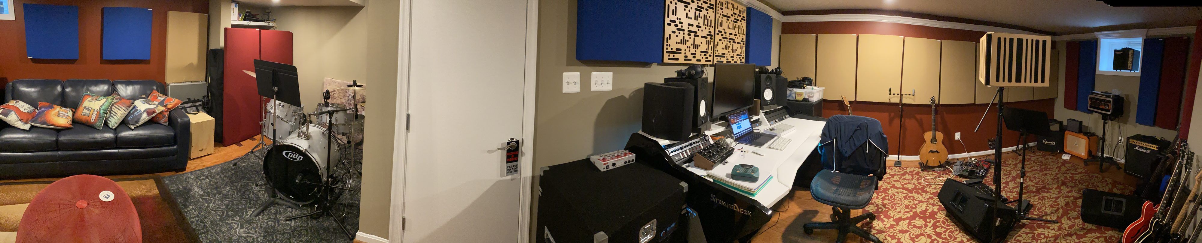 Panoramic view of Magnolia Hill Studio: the drum and lounge area, the mixing desk with monitors, and the live room with amps and guitars